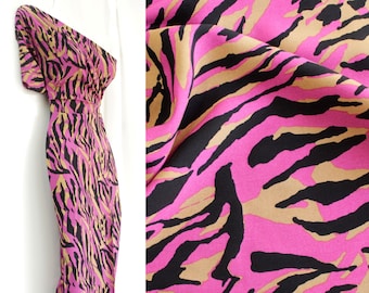 0.5 m "Animal fuchsia", 13.98 euros/meter, 145 cm wide, viscose woven fabric