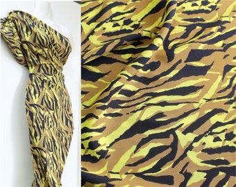 0.5 m "Animal yellow", 13.98 euros/meter, 145 cm wide, viscose woven fabric