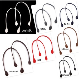 Può includere: Set di 10 manici per borse a mano in pelle di vari colori, tra cui bianco, grigio, blu, marrone, rosso e nero. I manici sono tutti della stessa dimensione e forma, e sono mostrati su uno sfondo bianco.