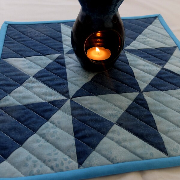 Quilted patchwork insulated pot holder, hot pad, trivet, snack mat, candle mat in dark and light blue