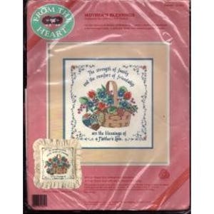 May include: Cross stitch pattern with a basket of flowers and fruit. The text reads "The strength of family and the comfort of friendship are the treasures of a mother's love."