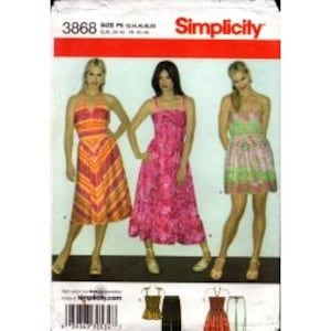 May include: Simplicity sewing pattern 3868 featuring three dress designs. The pattern includes a halter dress with orange and red chevron stripes, a pink floral print dress, and a green and pink floral dress. The pattern size range is 10-14-16-18.