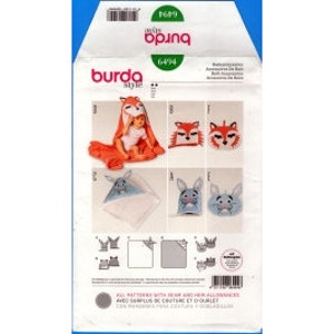May include: Burda Style sewing pattern for a hooded baby blanket with fox and bunny animal faces. The pattern includes instructions for making a fox hooded blanket in orange and a bunny hooded blanket in blue.