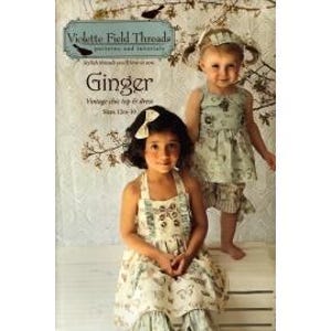 May include: Two young girls wearing matching dresses and headbands. The dresses are light-colored with a floral pattern. The image includes text that reads "Violette Field Threads" and "Ginger Vintage style top & dress".