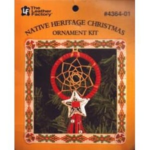 May include: A Native Heritage Christmas ornament kit. The kit features a red dreamcatcher with a star-shaped charm and beaded accents. The packaging includes the text "The Leather Factory" and "Native Heritage Christmas Ornament Kit".