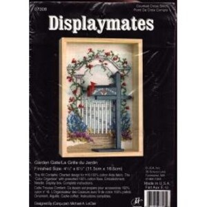 May include: A cross-stitch kit titled "Displaymates" featuring a framed garden scene. The artwork depicts a white picket fence, a gate, and a mailbox, surrounded by flowers and greenery. The finished size is 4.5" x 4.1" (11.5cm x 10.5cm).