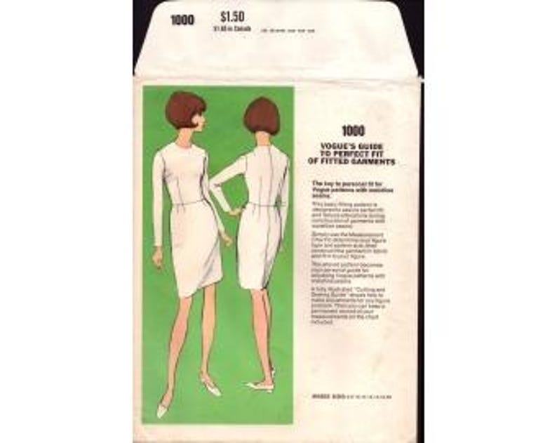 May include: A vintage sewing pattern envelope labeled 1000, Vogue's Guide to Perfect Fit of Fitted Garments. The front features a green rectangular panel with two illustrations of a figure in a long-sleeved white dress, shown from front and back views.