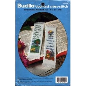 May include: A set of two white counted cross-stitch bookmark patterns. The first bookmark features a tree with green leaves and yellow flowers, with the text "This is the day the Lord has made, let us rejoice and be glad in it." The second bookmark features a flower pot with red, yellow, and purple flowers, with the text "Simple beauty is God's greatest creation."