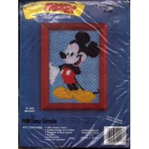 May include: A framed needlepoint kit featuring Mickey Mouse. The kit includes acrylic yarn, a double design on 12 mesh, canvas, needles, and instructions. The finished size is approximately 5 inches by 7 inches.