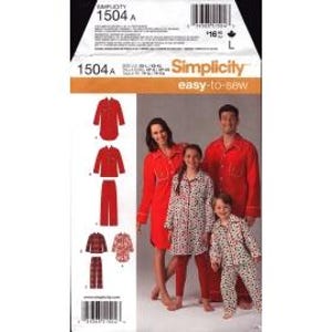 May include: Simplicity 1504A sewing pattern envelope featuring illustrations and photographs of pajamas. The design includes long-sleeved button-down shirts and pants in solid red or patterned fabric. The text includes Simplicity 1504A and easy-to-sew.