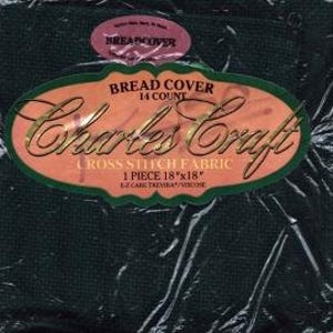 May include: A dark green cross-stitch fabric piece, 18" x 18", is packaged in clear plastic. The label reads "BREAD COVER" and "Charles Craft CROSS STITCH FABRIC." The fabric is 14 count and made of EZ CARE TREVIRA/VISCOSE.