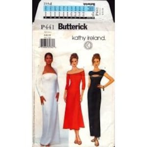 May include: A Butterick sewing pattern, P441, featuring three dress designs. The pattern includes a white, off-the-shoulder gown, a red dress with long sleeves, and a black dress with a keyhole detail. The pattern is designed by Kathy Ireland.