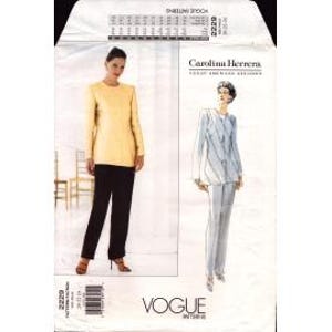 May include: Vogue sewing pattern featuring a Carolina Herrera design. The pattern includes instructions for a long-sleeved top and pants. The cover shows a woman in a yellow top and black pants, and a sketch of a woman in a blue and white outfit.