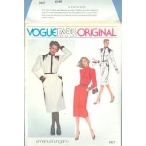 May include: Vogue Paris Original sewing pattern featuring designs by Emanuel Ungaro. The pattern envelope displays illustrations of three different outfits: a white dress with black trim, a red dress, and a white suit with black accents.