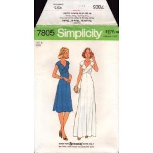 May include: Simplicity sewing pattern 7805 featuring two dress designs. The pattern envelope shows illustrations of a blue knee-length dress and a white floor-length dress. The envelope has a green and white color scheme with the Simplicity logo.
