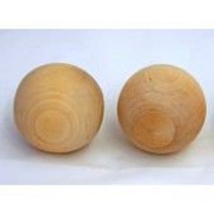 May include: Two unfinished wooden spheres, each about 3 inches in diameter.