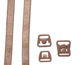 May include: Two beige bra straps with a beige plastic bra clasp and two beige plastic bra adjusters.