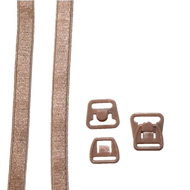 May include: Two beige bra straps with a beige plastic bra clasp and two beige plastic bra adjusters.