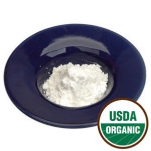 May include: A white powder in a blue bowl with a USDA Organic label.