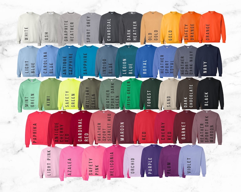 May include: A color chart of 40 different sweatshirt colors. The colors are arranged in rows and columns, with each color labeled with its name. The colors include white, light blue, mint green, paprika, light pink, kiwi, carolina blue, ash, antique cherry, azalea, safety green, graphite, sapphire, military green, cardinal red, safety pink, indigo blue, heather sport green, scarlet red, heliconia, legion blue, charcoal, irish green, maroon, orchid, dark heather red, royal blue, purple, forest green, old gold, cherry red, plum, sand, heather sport royal, garnet, heather dark sport maroon, chocolate, dark navy, orange, and black.