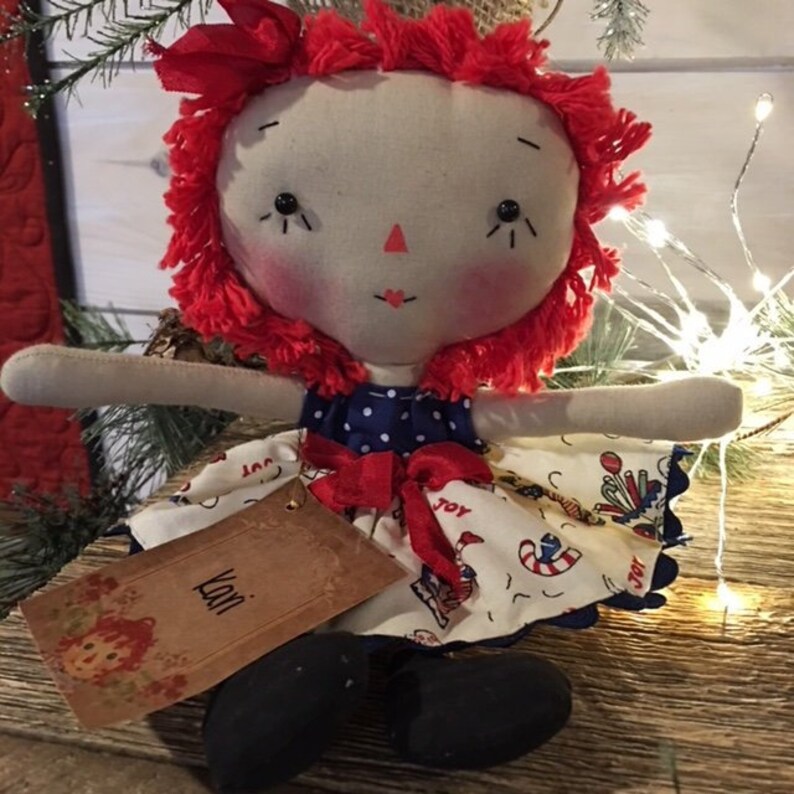 doll with red yarn hair