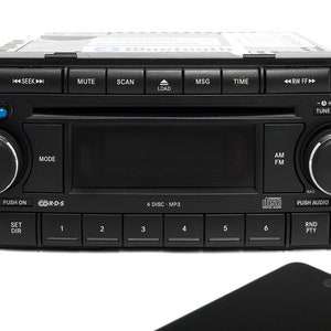 May include: A black car stereo with a CD player and a digital display. The stereo has buttons for seek, mute, scan, load, msg, time, rw ff, tune, mode, set dir, 1-6, am, fm, push on, cords, push audio, rnd pty.