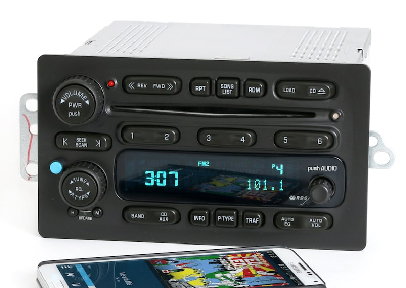 May include: A black car stereo with a digital display showing "307" and "101.1". The stereo has buttons for "FM2", "P-Type", "Traf", "Auto EQ", and "Auto Vol".