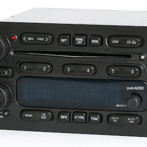 May include: Black car stereo with a CD player, digital display, and buttons for volume, power, seek, scan, tune, rcl, rpt, song list, rdm, load, cd, band, aux, info, p-type, traf, auto eq, and auto vol.