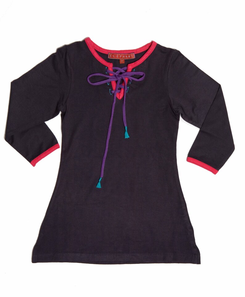 May include: A dark grey long-sleeved top with a lace-up neckline. The neckline and cuffs are trimmed in red, with purple and teal accents on the lace-up detail. The brand name "ELEPHANT" is visible on a small tag near the neckline.