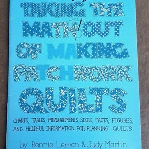 May include: A blue book cover with the title "Taking the Math Out of Making Patchwork Quilts" in white letters with a floral pattern. The book is by Bonnie Leman & Judy Martin.