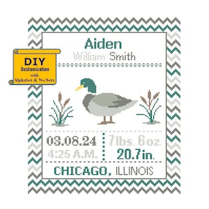 May include: A cross-stitch design featuring a duck with green head and gray body, surrounded by green reeds. The design includes the name Aiden William Smith, birth date 03.08.24, time 4:25 A.M., weight 7 lbs. 6 oz., length 20.7 in., and location Chicago, Illinois.
