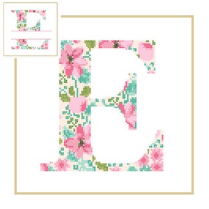 May include: A floral patterned letter E in pink, green, and white. The letter is surrounded by a gold frame.