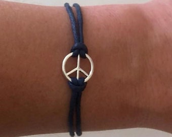 Pulsera o tobillera con el signo de la paz USTED selecciona el color y la longitud del cordón