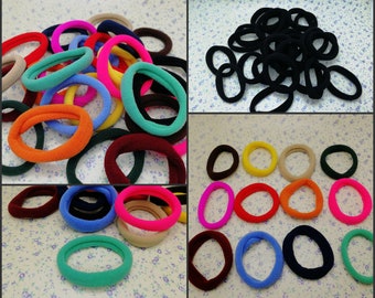 May include: Assortment of colorful hair elastics in various sizes and styles. The hair ties are made of soft, stretchy fabric and are perfect for holding back hair.