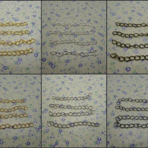 May include: Six rows of gold, silver, and bronze chain links. Each row contains four chain links.