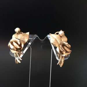 Vintage gold washed clip back flowered earrings signed STAR