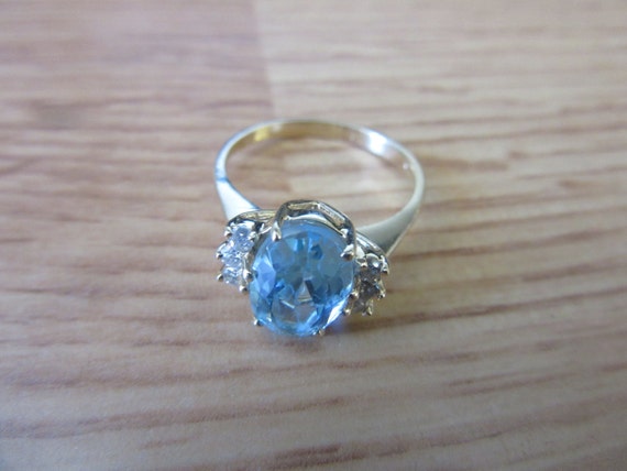 14K yellow gold oval blue topaz and 1/10ct diamon… - image 1