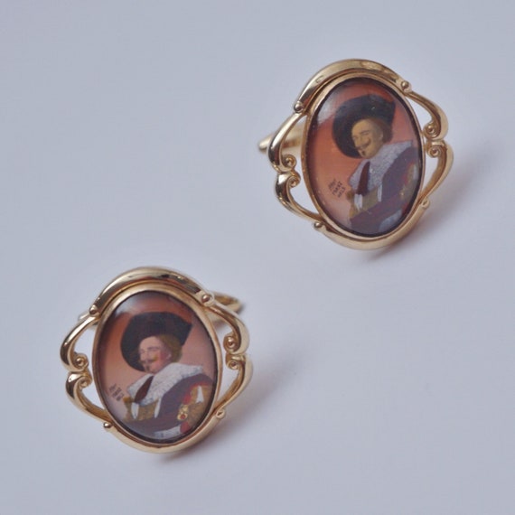 Vintage pair cufflinks by Stratton, The Laughing Cavalier, signed after Franz Hals, gold gilt & reverse painting on glass, 1920s ca, English