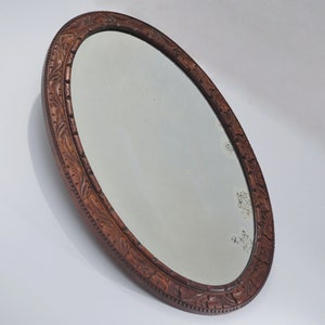 Antique Blackforest style oval wall mirror, large hand carved oak frame with original antique bevelled mirror plate, 1910s ca, English