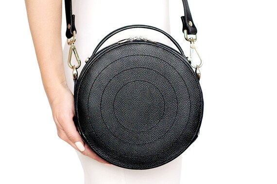 black round crossbody bag