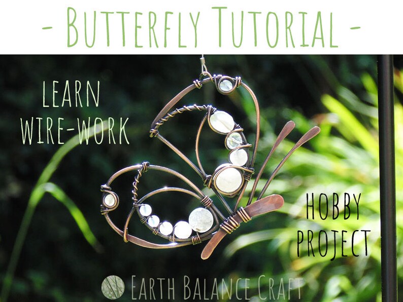K&ouml;nnte beinhalten: Ein Schmetterling aus Kupferdraht mit wei&szlig;en Perlen, ein Hobby-Projekt-Tutorial. Lerne Drahtarbeiten mit diesem Bastelprojekt.  "Earth Balance Craft" steht auf dem Bild.