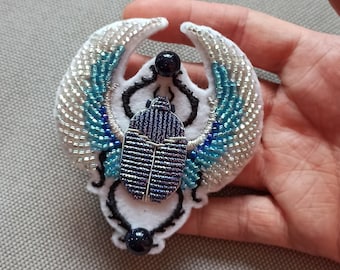 Blue winged scarab embroidered brooch - gold embroidery.