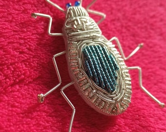 Beetle embroidered brooch - gold embroidery.