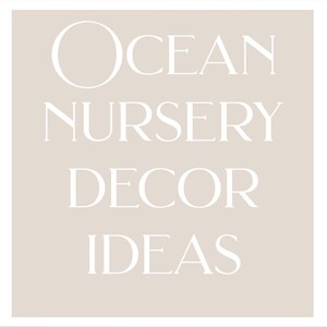 May include: Seashell crib bedding and ocean nursery decor ideas. The image shows a baby lying on a crib sheet with seashell and starfish patterns. A soft blanket with seashell and starfish designs is also visible.