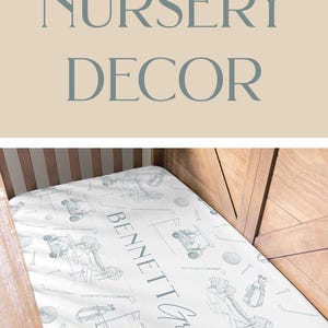May include: Golf-themed nursery decor set. Includes framed prints with golf bag, flag, and golf cart illustrations, plus a crib sheet with golf-related drawings. The prints have a light blue and beige color scheme.