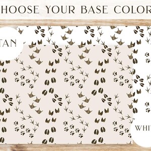 May include: A digital design featuring a pattern of brown bird and animal footprints on a white or tan background. The text "Choose Your Base Color" is at the top of the image. The words "Tan" and "White" are in circles at the bottom of the image.