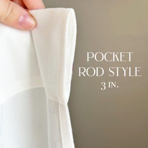 May include: Close-up of a white curtain with a 3-inch pocket for a rod. The pocket is sewn with a white fabric.