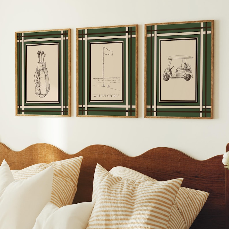 May include: Set of three framed golf-themed prints. Each print features a black and white illustration on a cream background, framed with a dark green border and a light brown frame. The prints depict golf clubs, a flag on the green, and a golf cart.