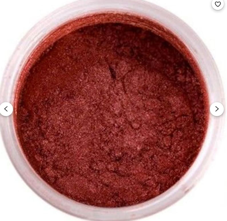 May include: A small jar of red metallic luster dust. The dust is fine and shimmery, and it is perfect for adding a touch of sparkle to crafts and projects.