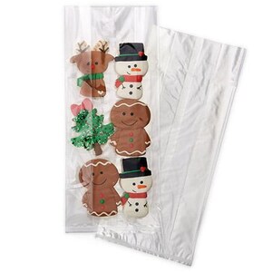 May include: Clear cellophane bag filled with Christmas-themed cookies. The cookies include a reindeer, snowman, gingerbread man, and Christmas tree. The cookies are decorated with colorful icing and placed in a clear bag.